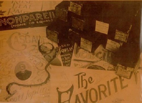 Scott Joplin's table top littered with sheet music and pocket watch