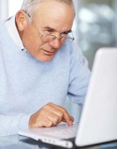Elderly man using internet